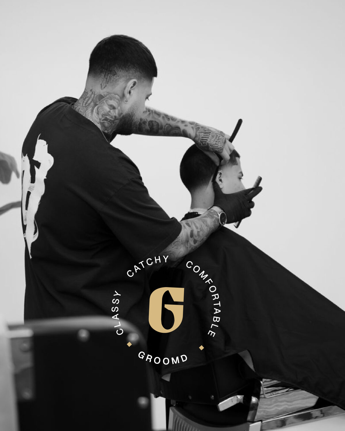 A Groomr barber working with a client